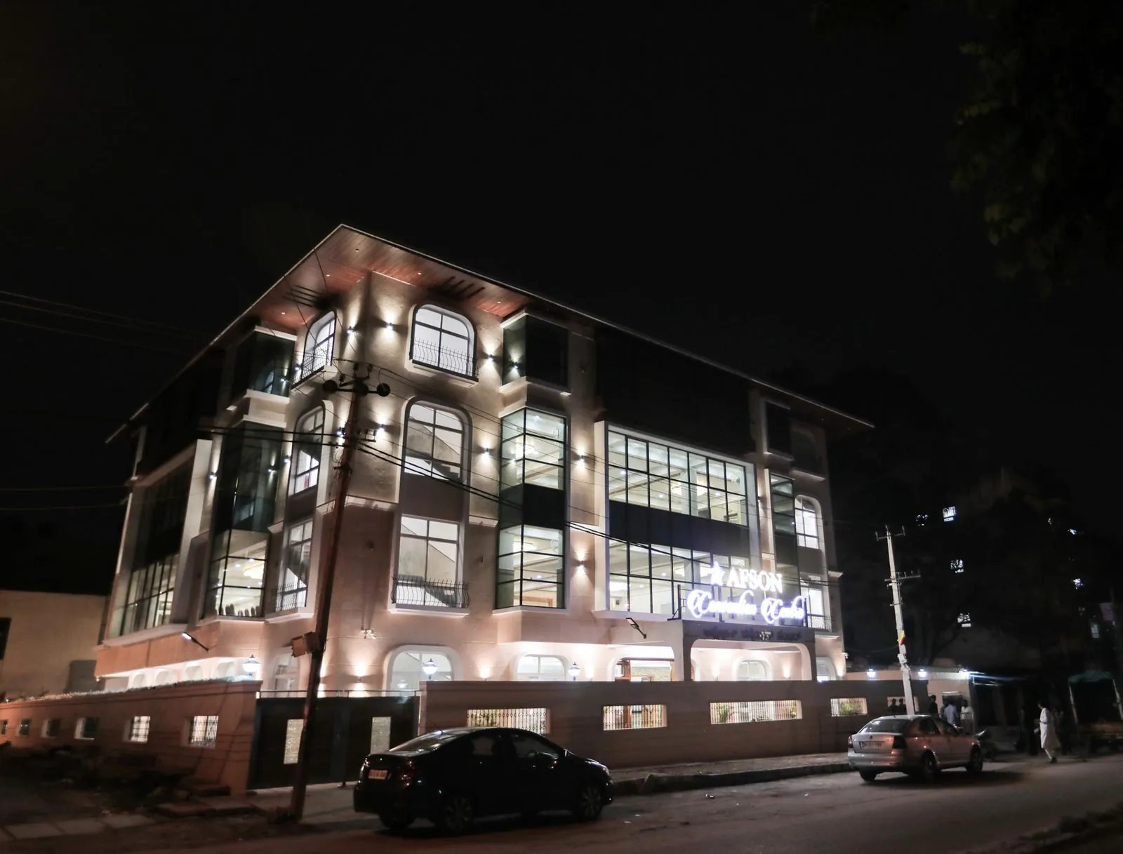 AFSON Convention Centre building lit up at night, HBR Layout, Bengaluru
