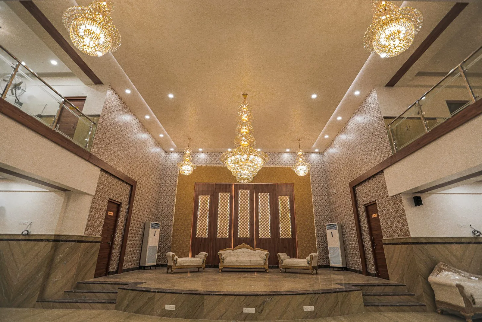 Wedding stage and chandeliers in the AC hall at AFSON Convention Centre, HBR Layout